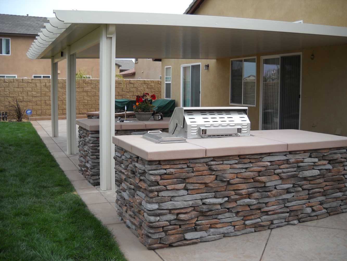 Solid & Lattice patio covers & rain gutters