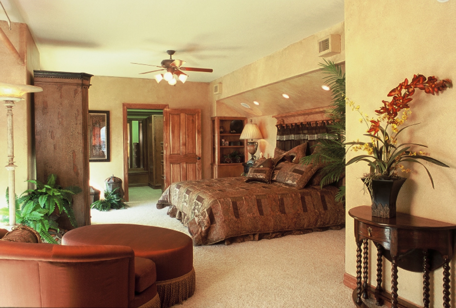 In the Lap of Luxury Master Bedroom Suites by Frontier Custom Builders, Inc.