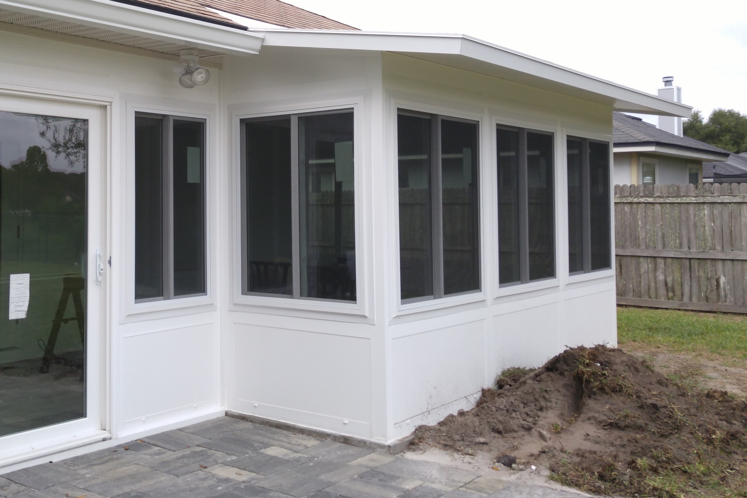 Nobles LivingSpace studio sunroom and paver patio