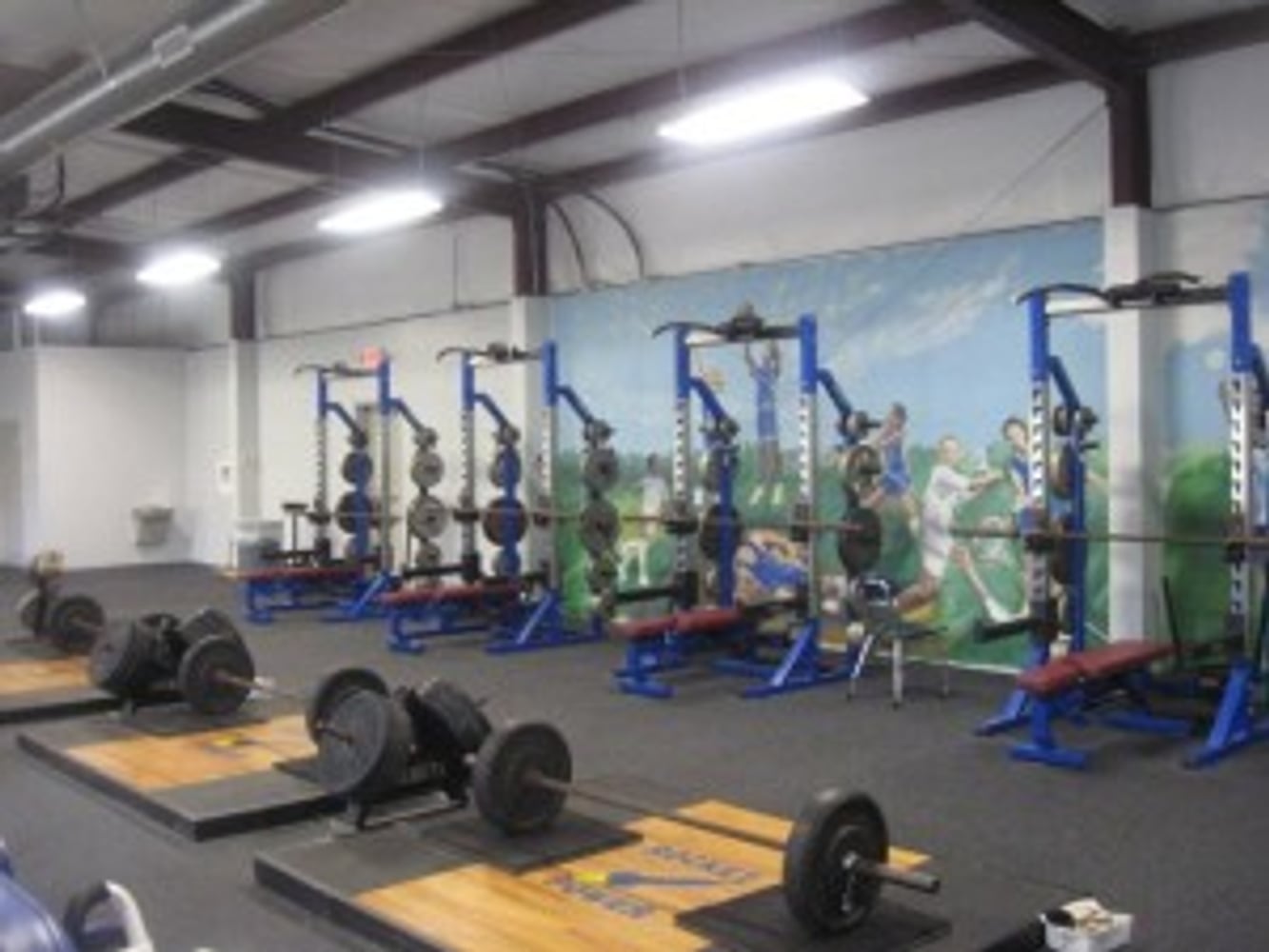 Rocket Club Weight Room by C.H.I. Construction Inc.