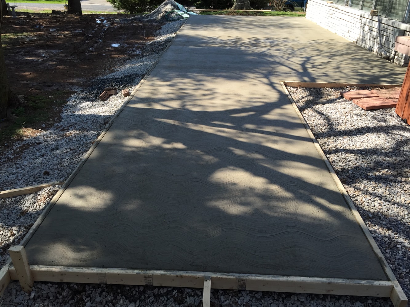 Retaining walls concrete pads and patio