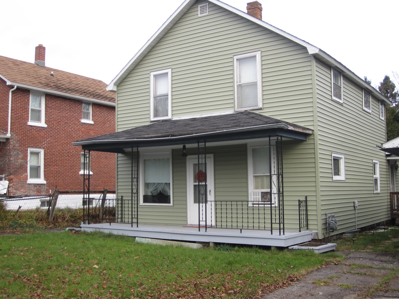 siding / new framed roof over existing flat