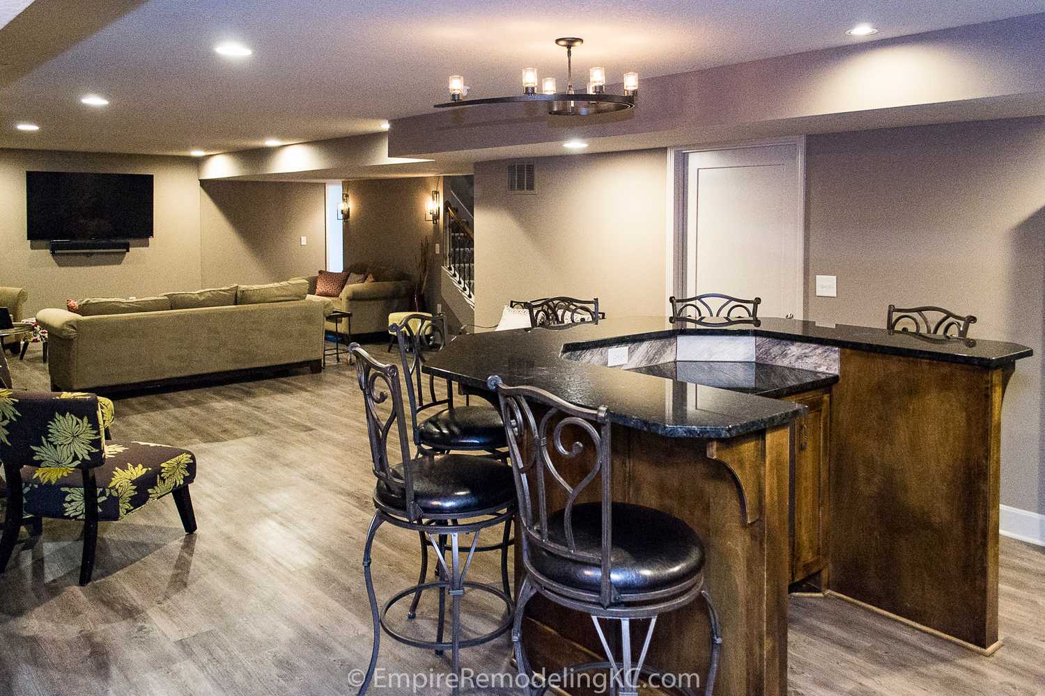 Basement remodel with kitchen, wetbar, bathroom, living area and bedrooms