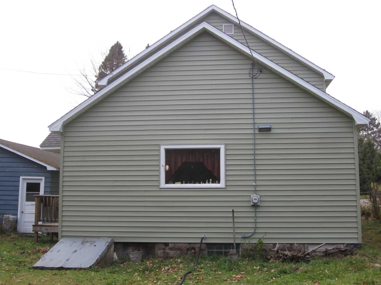 siding / new framed roof over existing flat