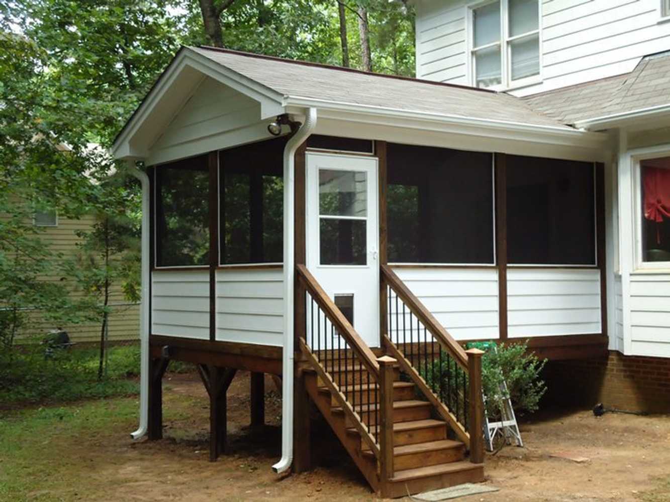 Deck converted to screened porch in Garner. Rotted masonite siding replaced with Hardi Plank.