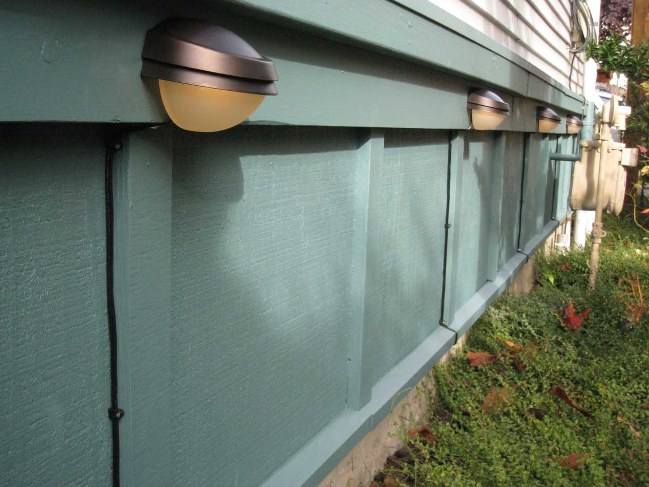 Walkway lighting and fence stain