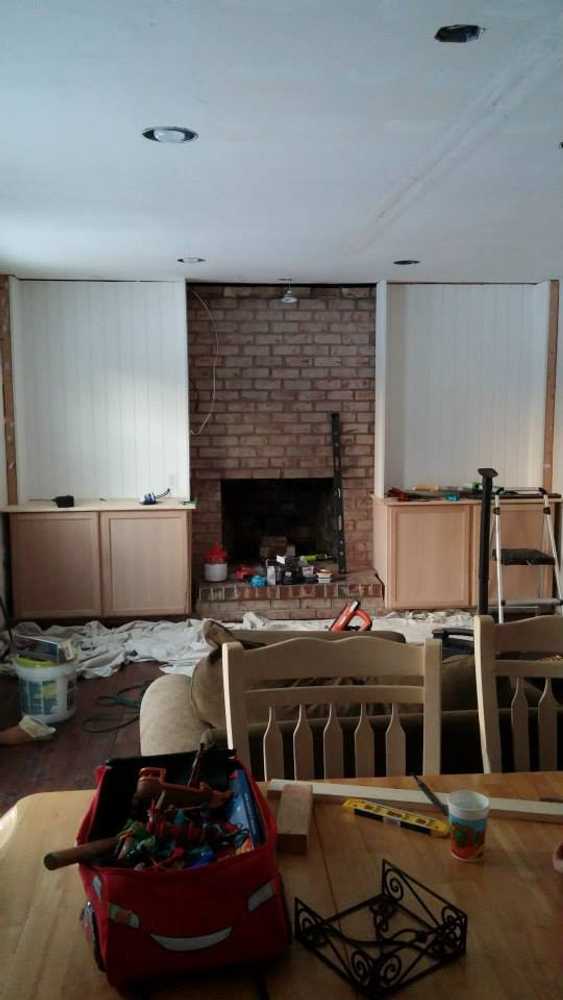bookshelves and stone work on old fireplace