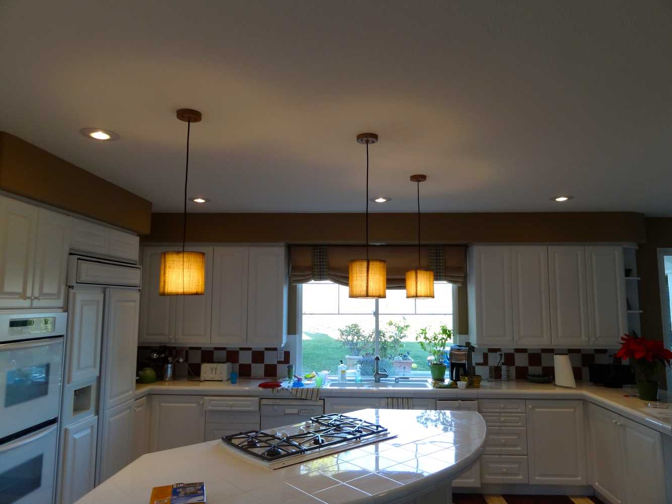 Carlsbad, California. pendants over Island and Chandalier over dining table.