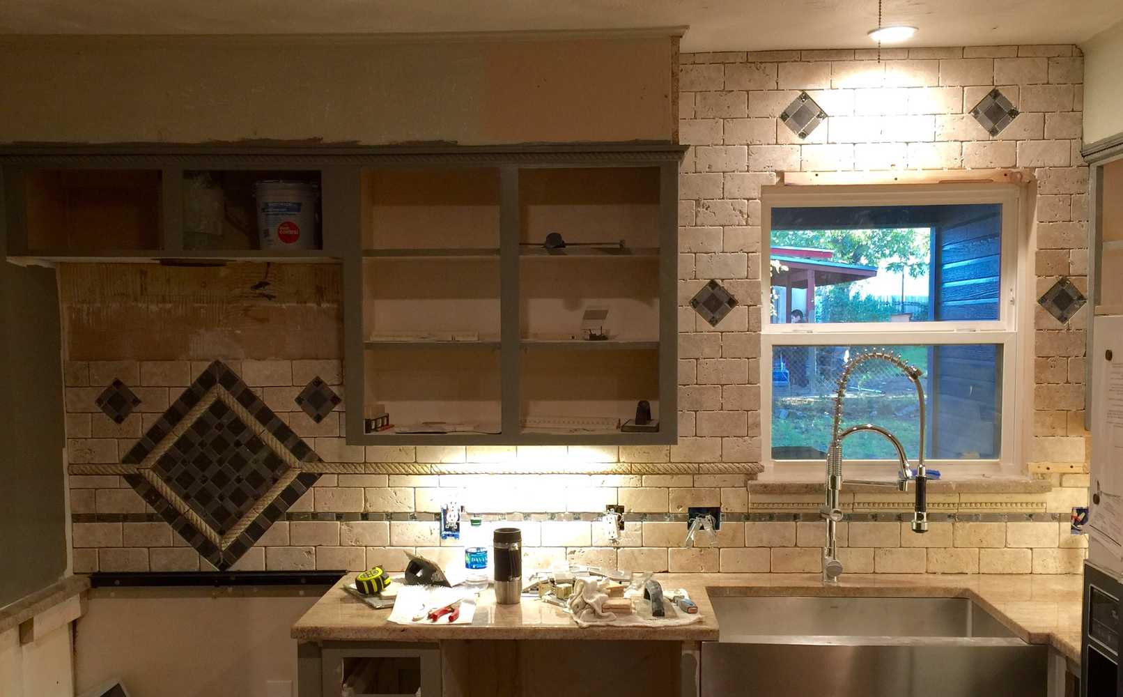 Hidden safe, complete kitchen remodel custom mosaic backsplash and cabinets