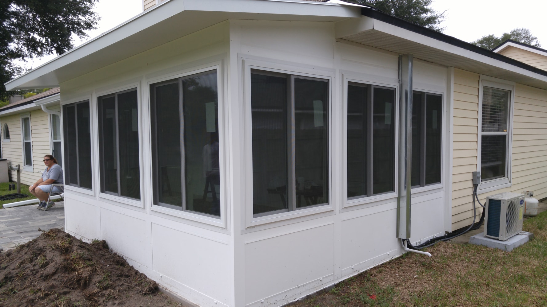 Nobles LivingSpace studio sunroom and paver patio
