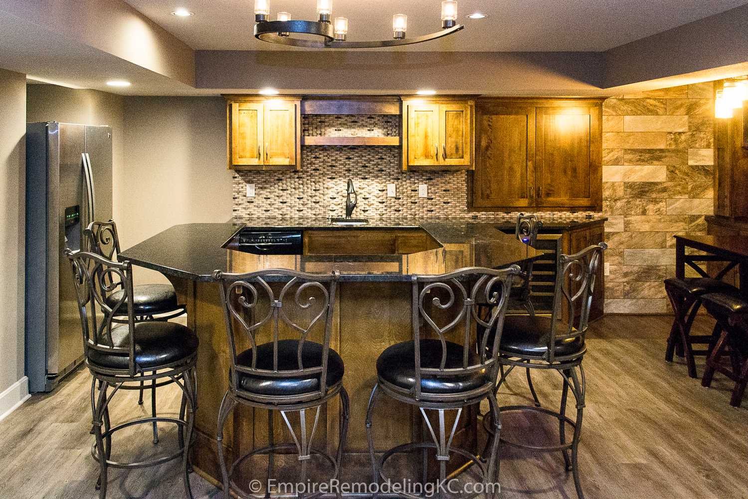 Basement remodel with kitchen, wetbar, bathroom, living area and bedrooms