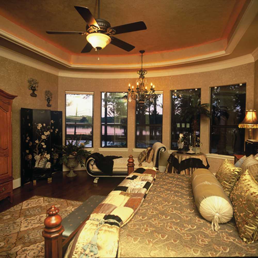 In the Lap of Luxury Master Bedroom Suites by Frontier Custom Builders, Inc.