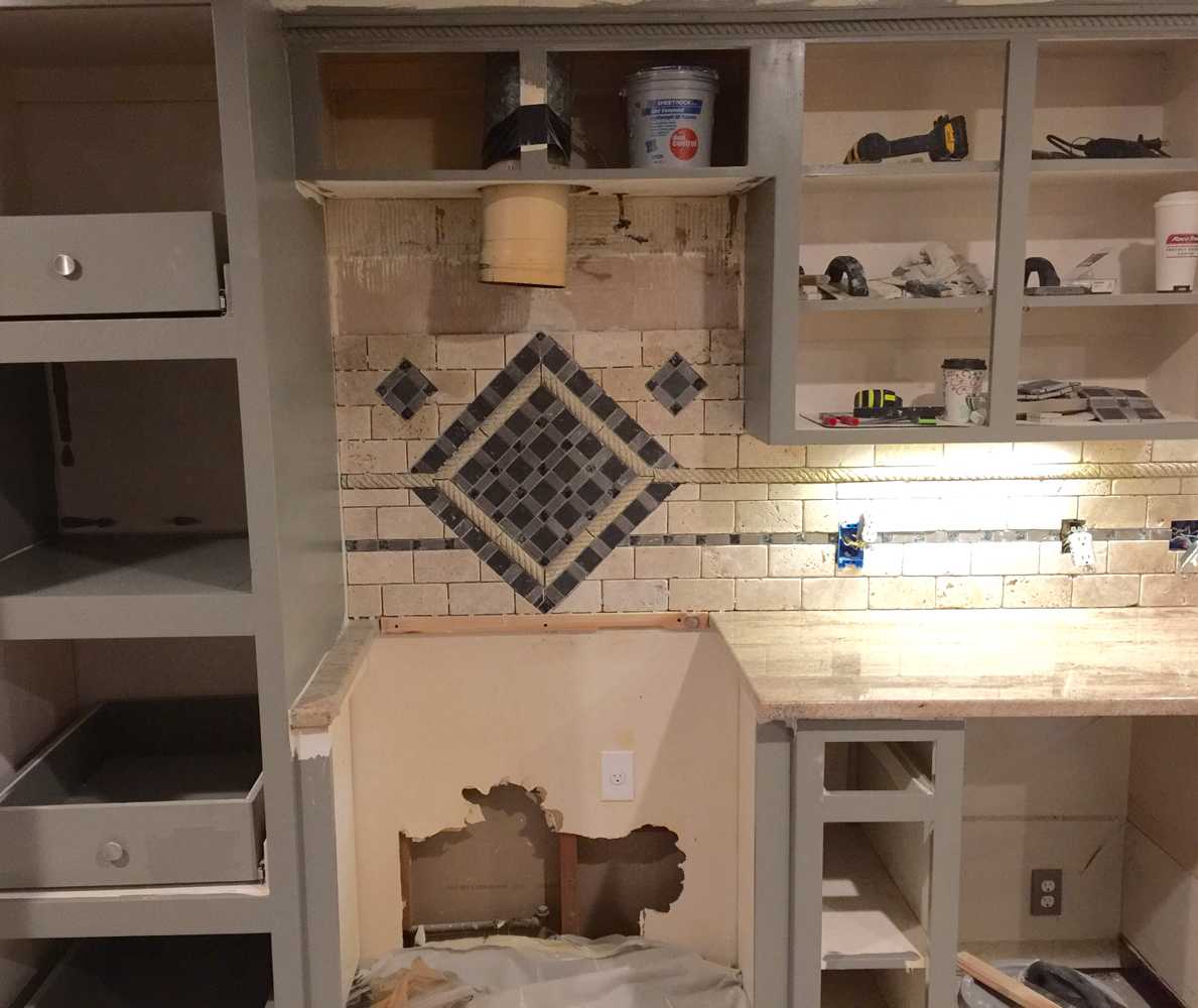 Hidden safe, complete kitchen remodel custom mosaic backsplash and cabinets