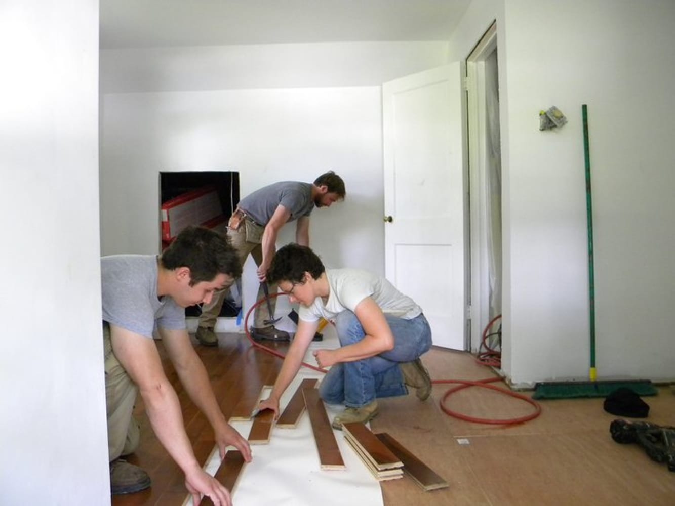 The Crew laying down hardwood flooring in Springfield