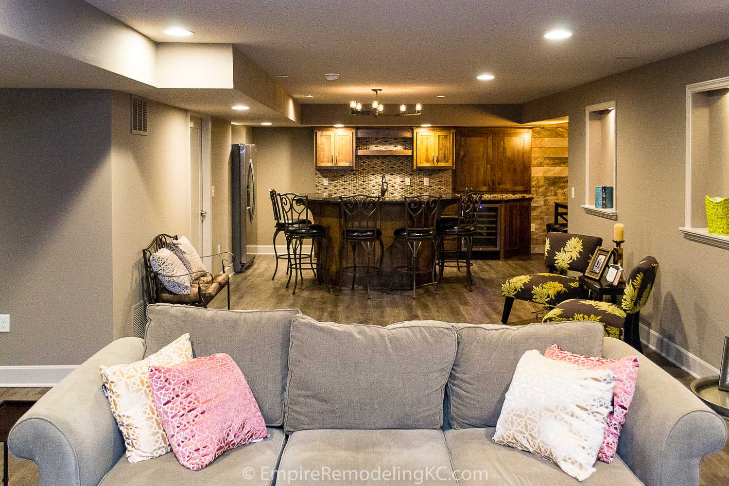 Basement remodel with kitchen, wetbar, bathroom, living area and bedrooms