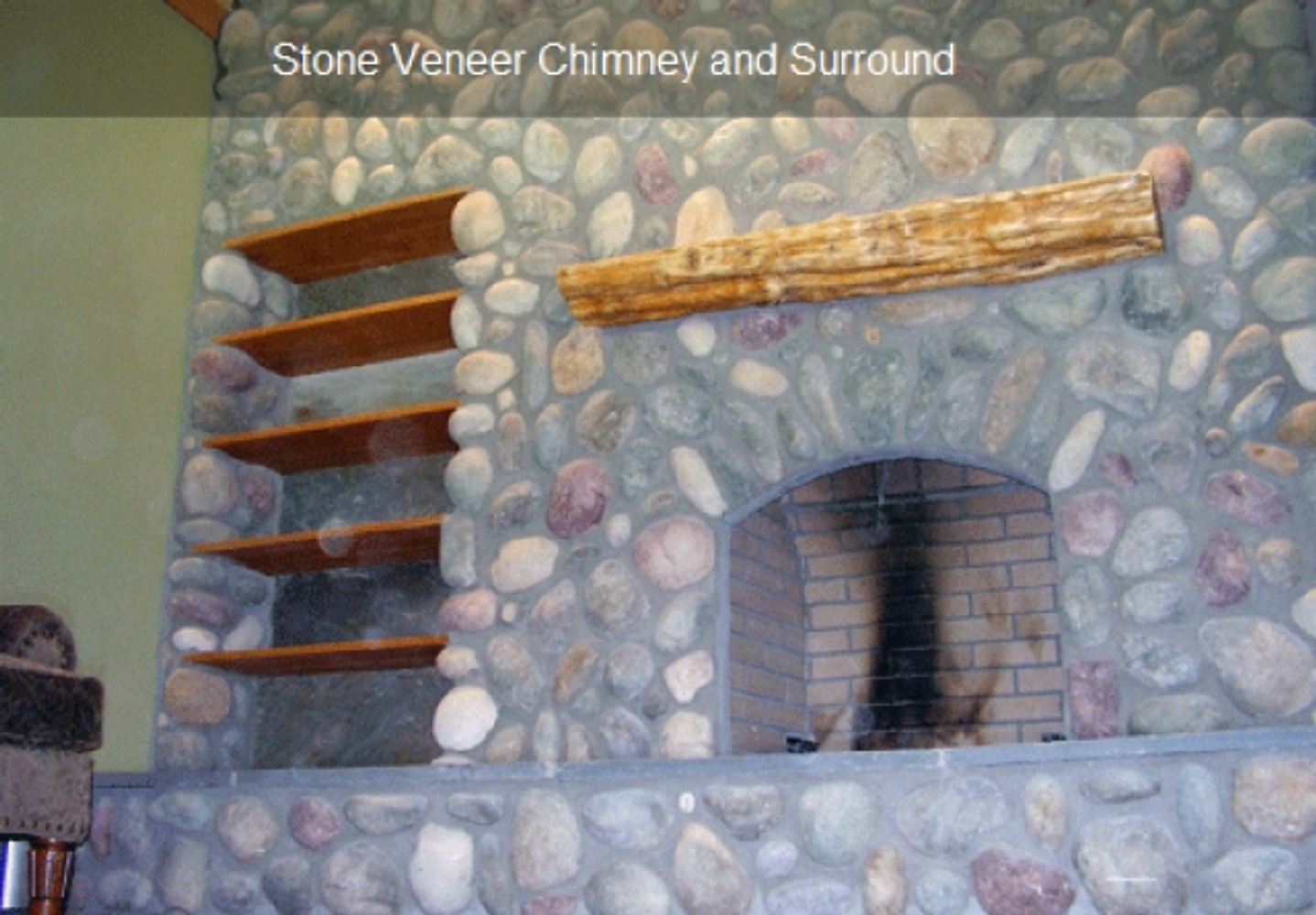 Stone veneer chimney and surround
