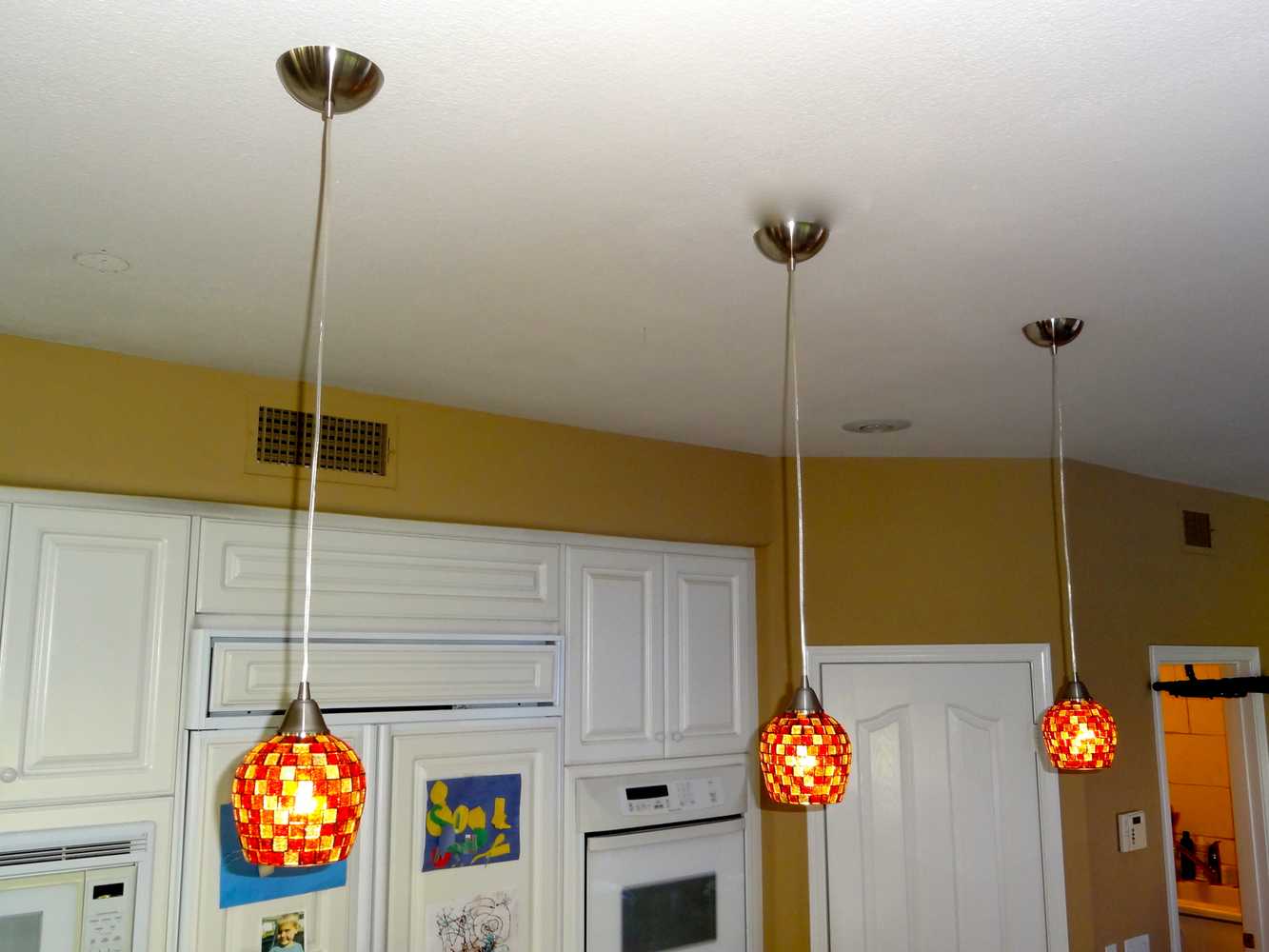 Carlsbad, Ca, kitchen pendants over Islands, and Dining chandalier.