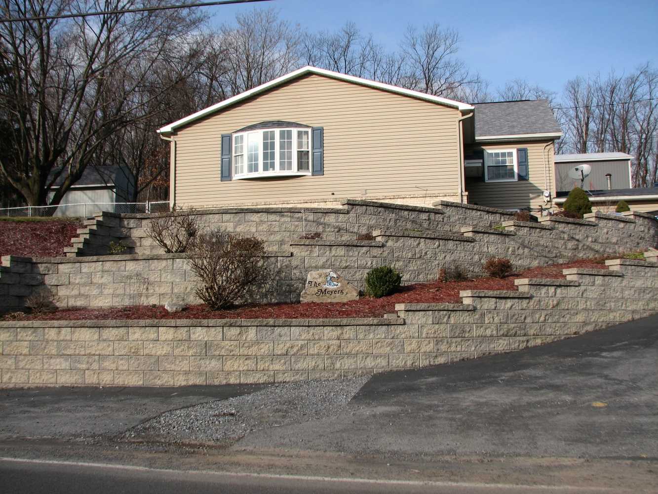 Retaining walls, accented driveways, and raised porches