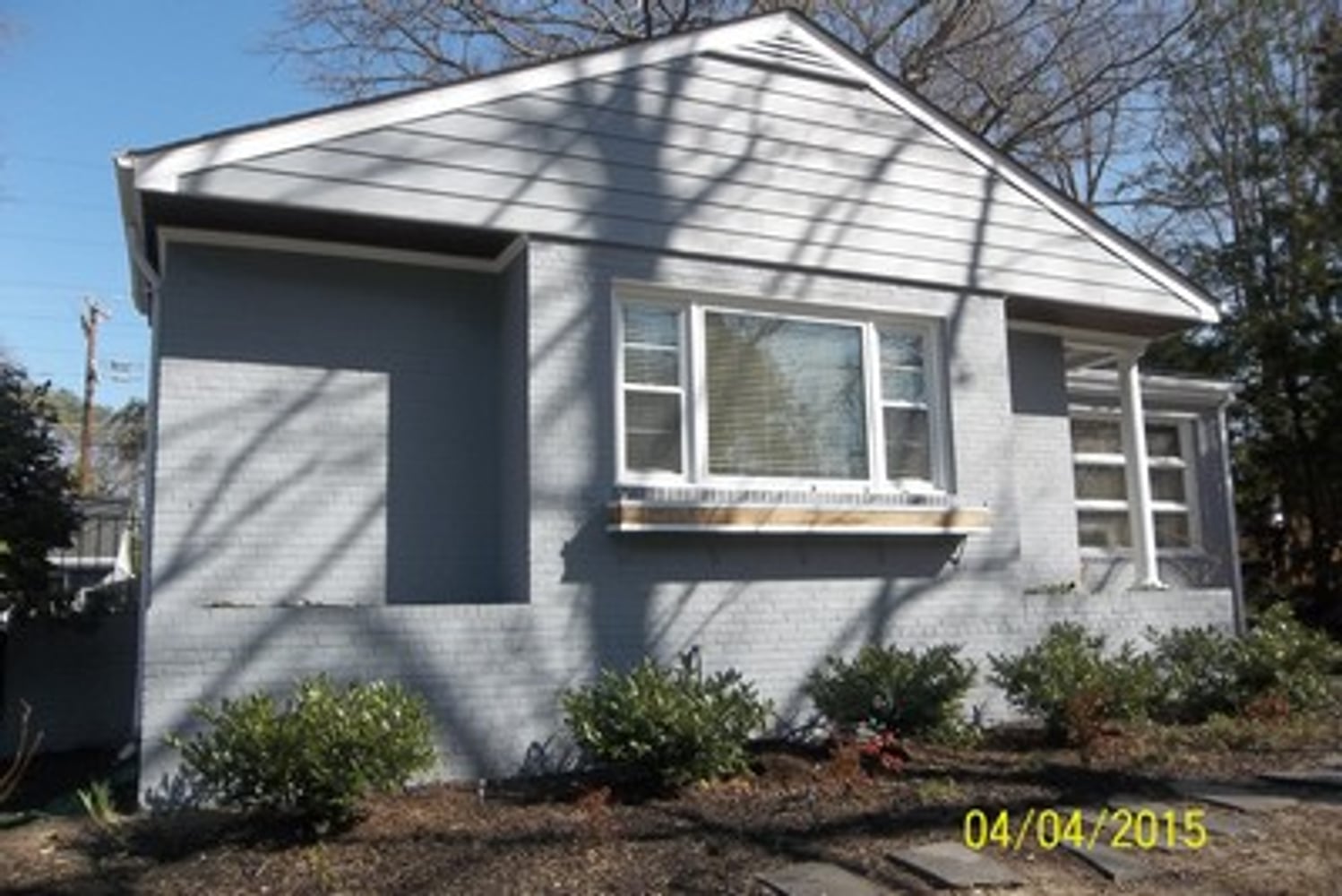 EXTERIOR PAINT BRICK (WHOLE HOUSE) AND DETACHED GARAGE