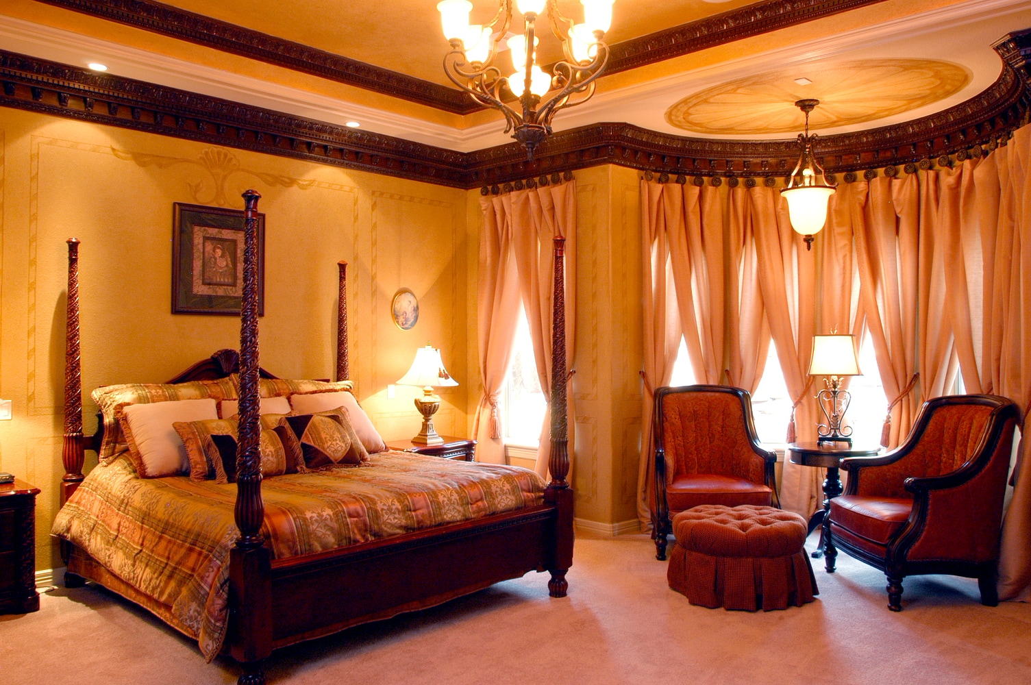 In the Lap of Luxury Master Bedroom Suites by Frontier Custom Builders, Inc.