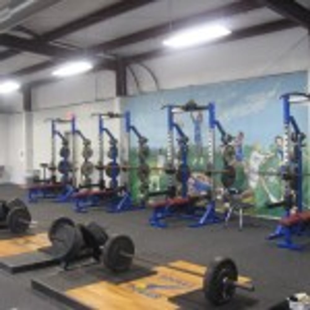 Rocket Club Weight Room by C.H.I. Construction Inc.