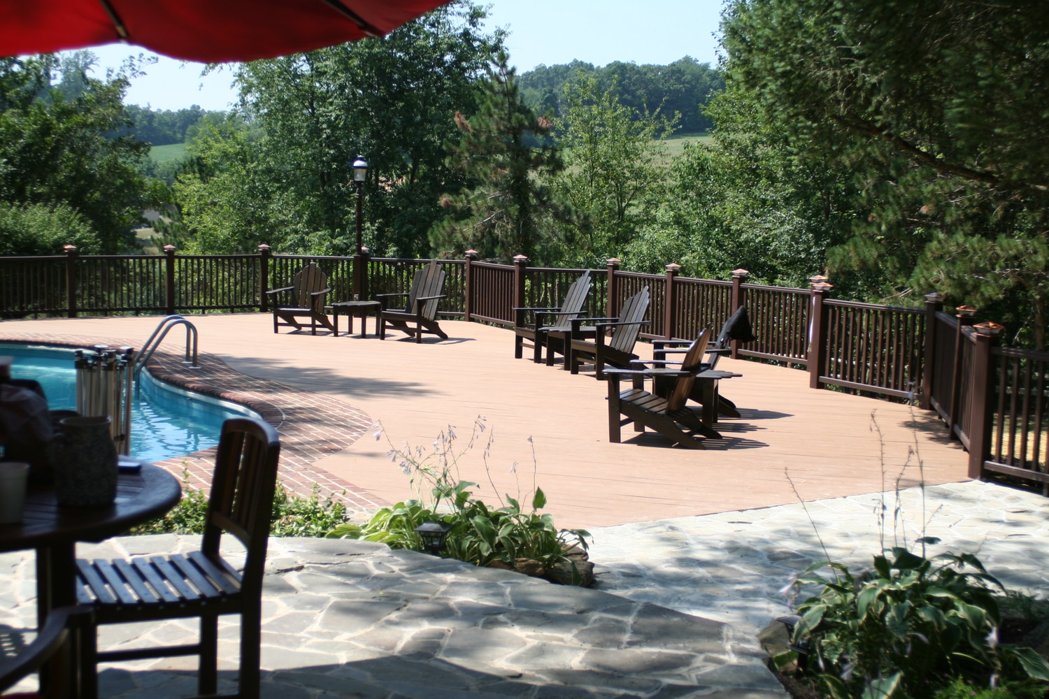 Trex deck with hardscape stone patios with landsca