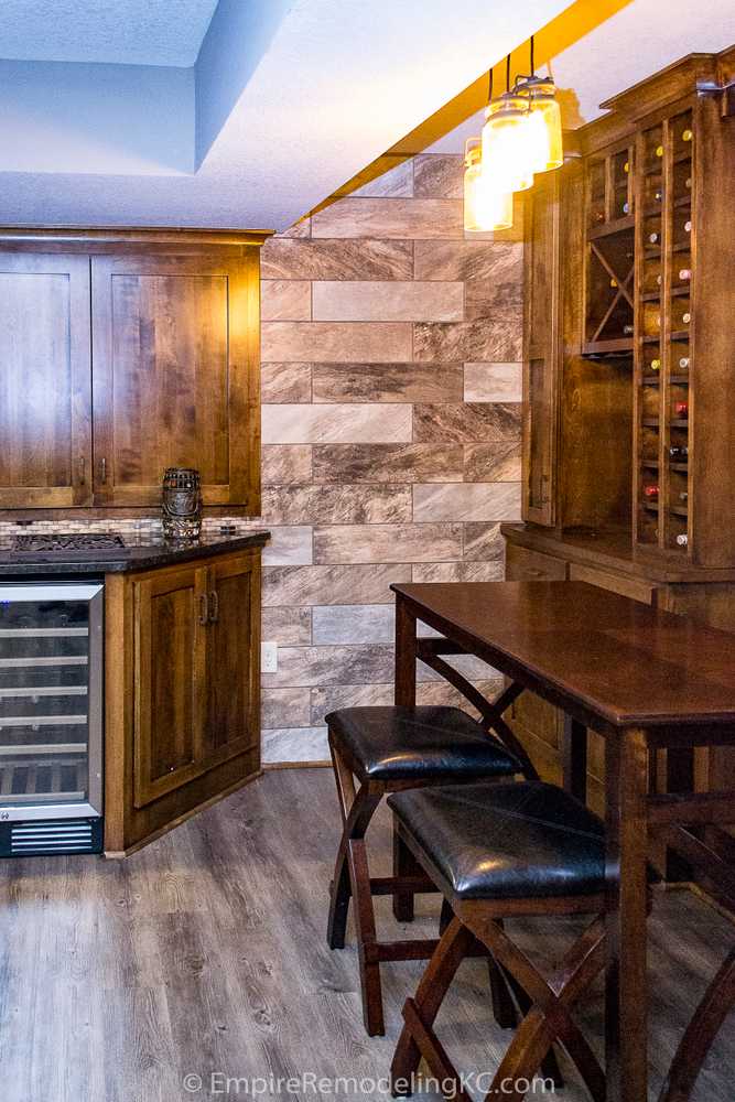 Basement remodel with kitchen, wetbar, bathroom, living area and bedrooms