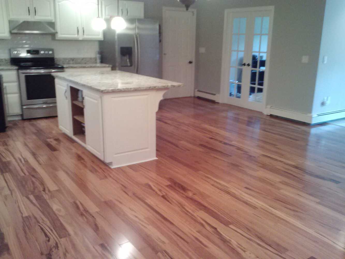 Installed Pre-Finished Hardwood Flooring (Bellawood Brazilian Koa) that our client purchased at Lumber Liquidators