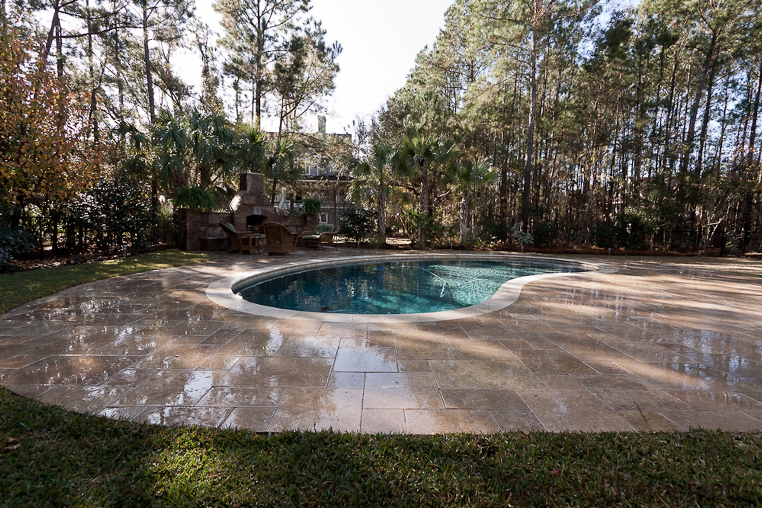 Travertine Pool Deck with custom design Oudoor Fireplace