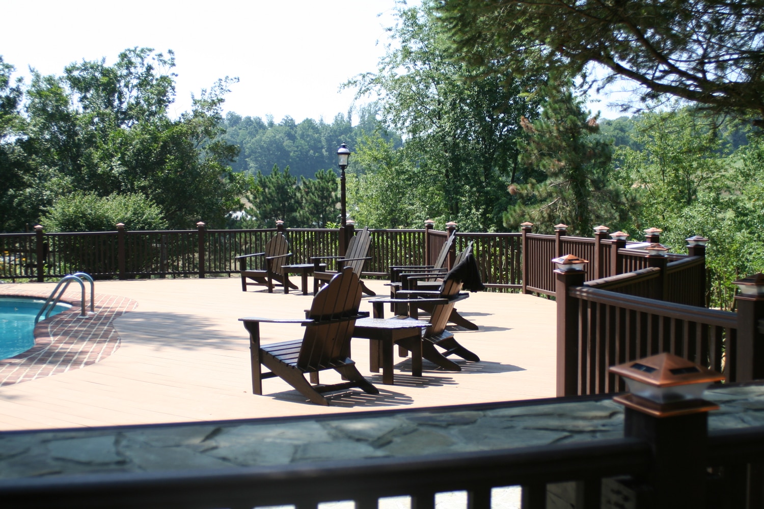 Trex deck with hardscape stone patios with landsca