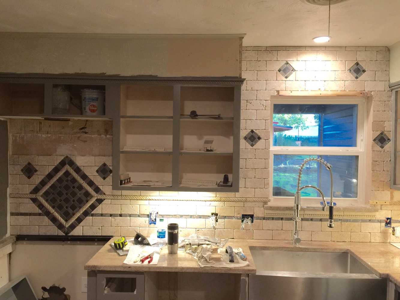 Hidden safe, complete kitchen remodel custom mosaic backsplash and cabinets