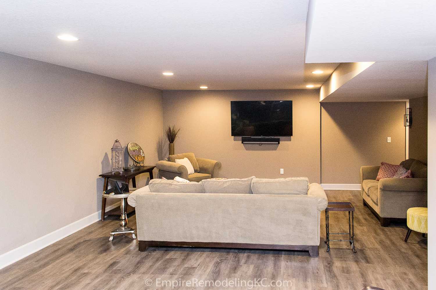 Basement remodel with kitchen, wetbar, bathroom, living area and bedrooms