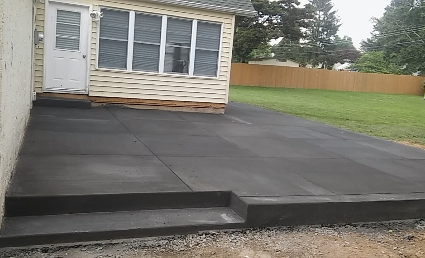 Patio replacement, Wood to concrete with grooves and curb appeal 