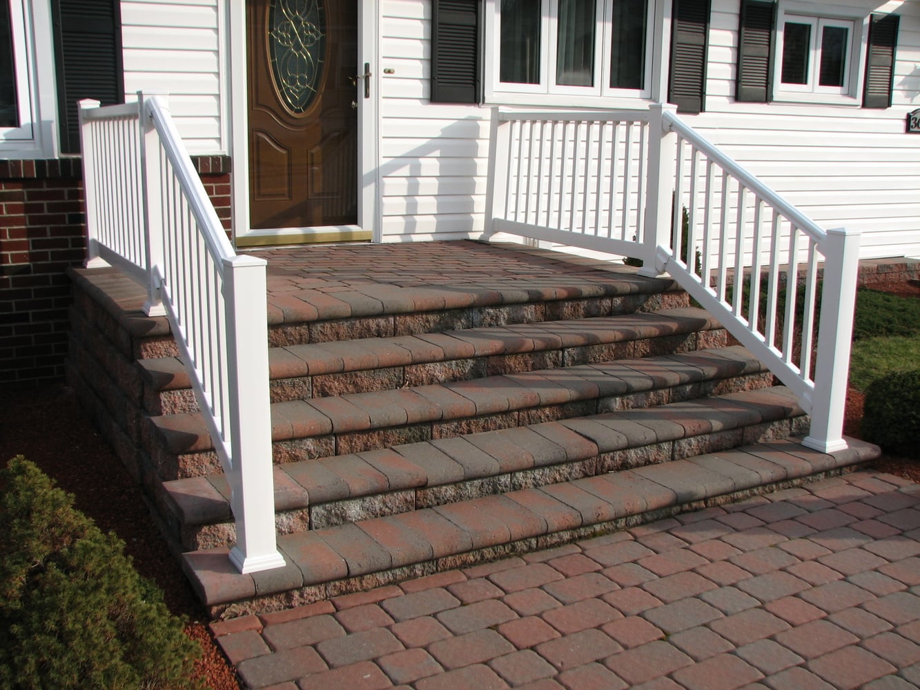 Retaining walls, accented driveways, and raised porches