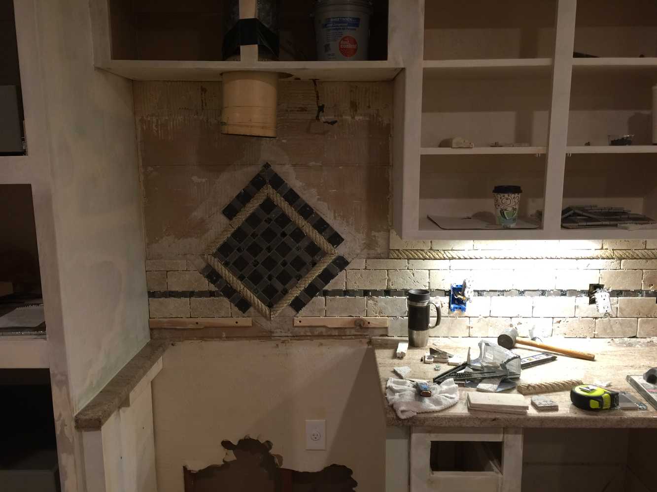 Hidden safe, complete kitchen remodel custom mosaic backsplash and cabinets