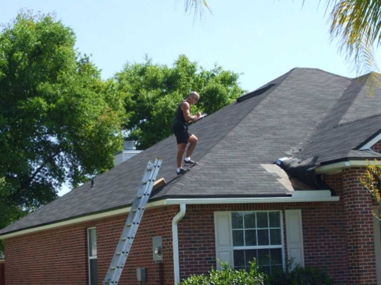 James Neill inspecting a roof 