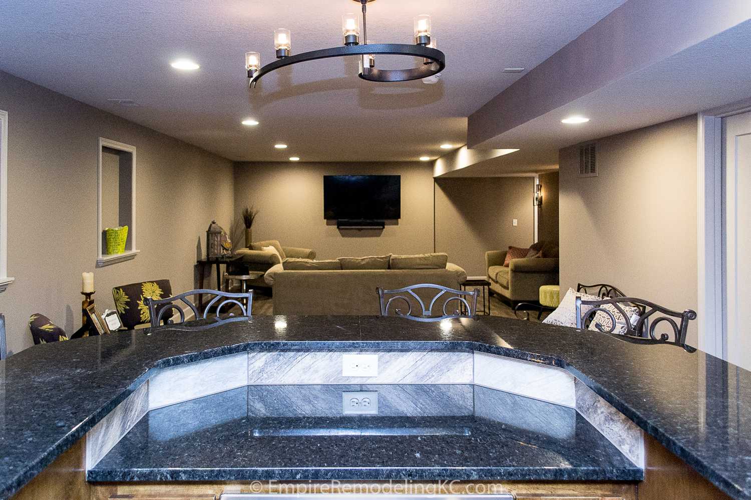 Basement remodel with kitchen, wetbar, bathroom, living area and bedrooms