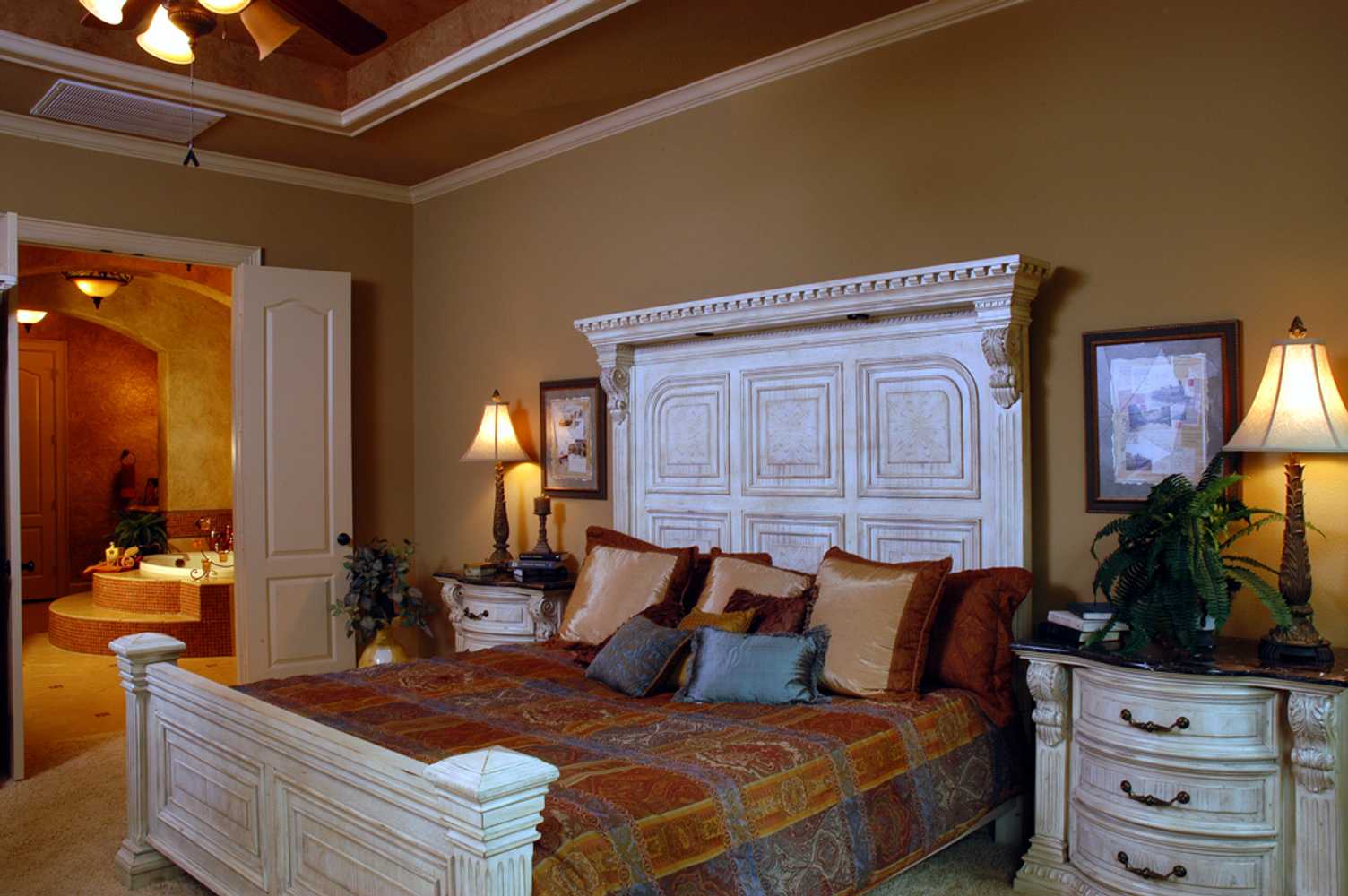 In the Lap of Luxury Master Bedroom Suites by Frontier Custom Builders, Inc.