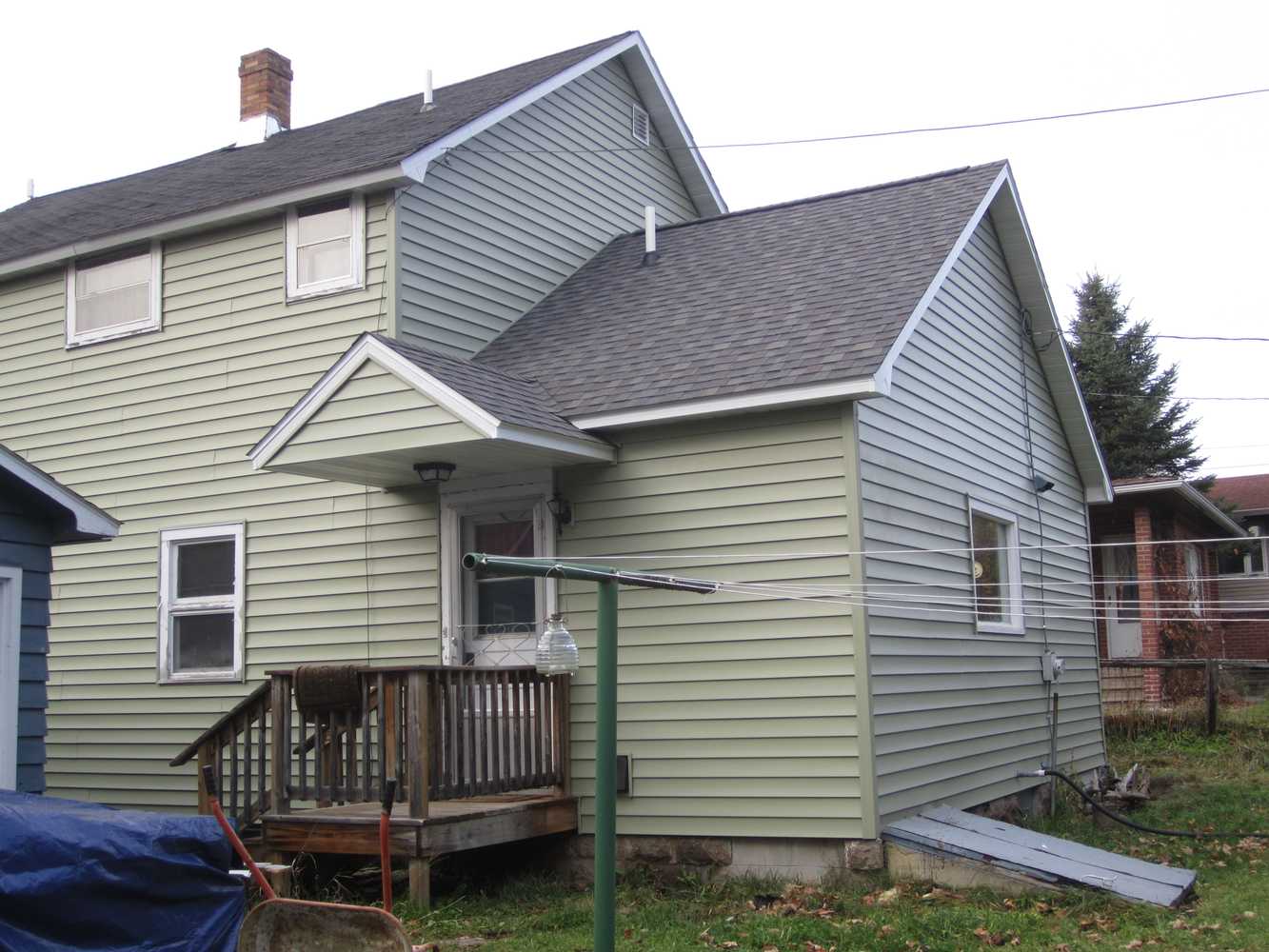 siding / new framed roof over existing flat