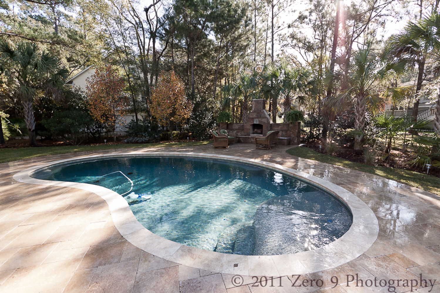 Travertine Pool Deck with custom design Oudoor Fireplace