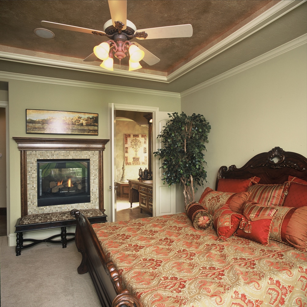 In the Lap of Luxury Master Bedroom Suites by Frontier Custom Builders, Inc.