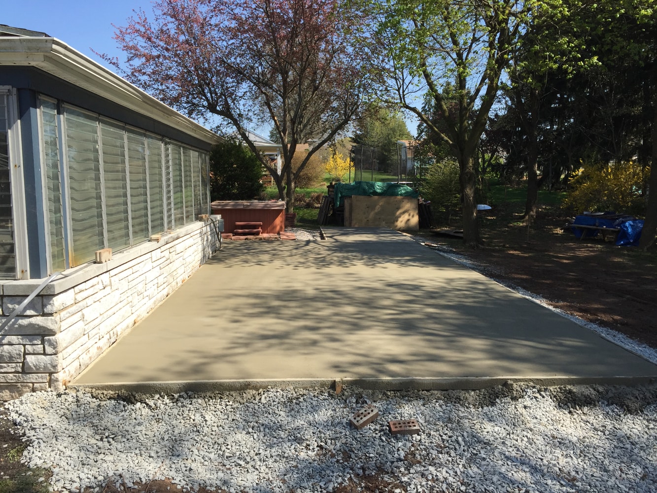Retaining walls concrete pads and patio